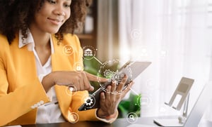 business woman touching tablet with technology lines overlayed