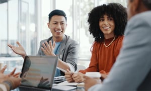 happy business people chatting at a conference table